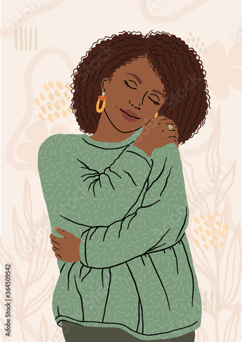 Tableau sur toile Portrait of nice African American woman hugging herself