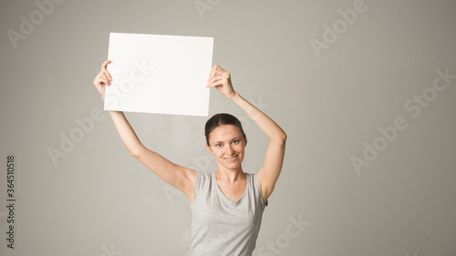 Girl holding white blank sign