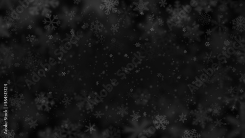 Christmas background of snowflakes of different shapes, sizes, blur and transparency in black colors