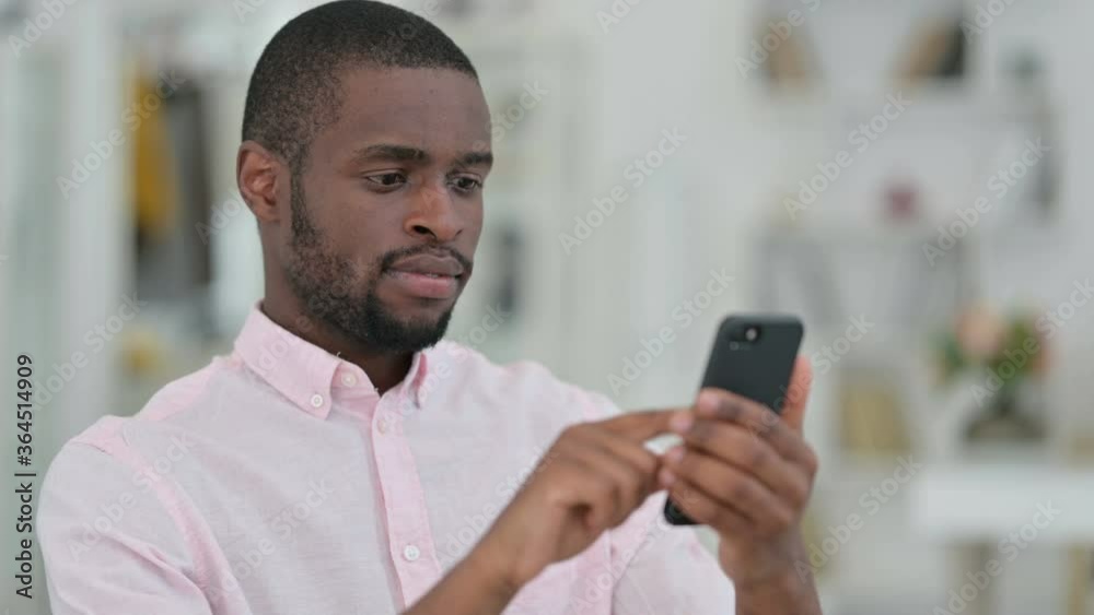 Portrait of Serious African Man using Smartphone Portrait of Serious African Man using Smartphone