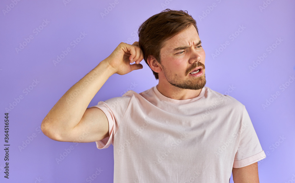 thoughtful caucasian bearded guy isolated in studio, young man is worried about something thoughtful caucasian bearded guy isolated in studio, young man is worried about something