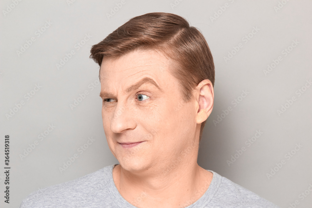 Portrait of happy charismatic mature man with one eyebrow raised Portrait of happy charismatic mature man with one eyebrow raised