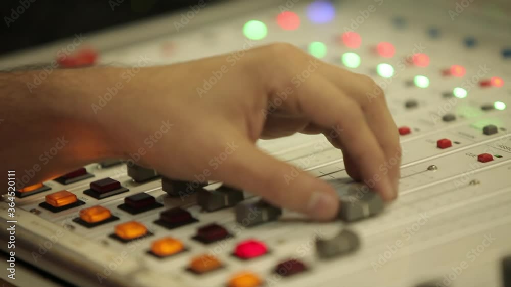 Audio mixer. Sound table. Sound equipment. DJ, sound technician or music producer who produces music in a studio. Audio mixer. Sound table. Sound equipment. DJ, sound technician or music producer who produces music in a studio.