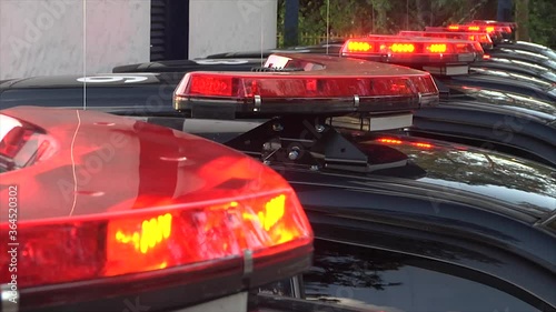 Flashing red light on the police car with blurred background.