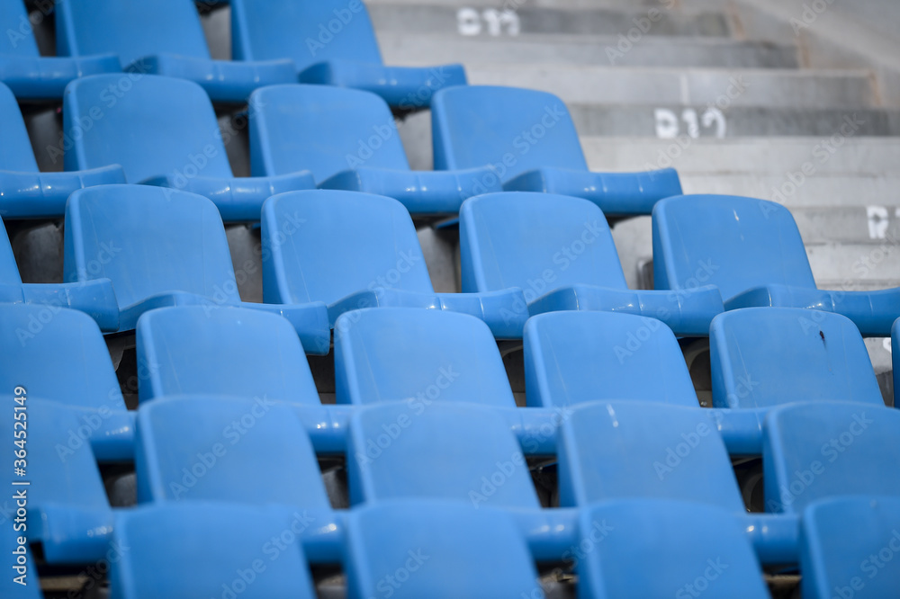 Empty soccer stadium tribune. As a safety measure during corona virus pandemic, soccer matches are taking place without public Empty soccer stadium tribune. As a safety measure during corona virus pandemic, soccer matches are taking place without public