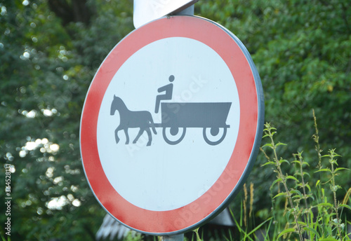 DESESTI, MARAMURES, ROMANIA, SUMMER 2018. Traffic sign for horse carriages in the parking lot of the church of Desesti