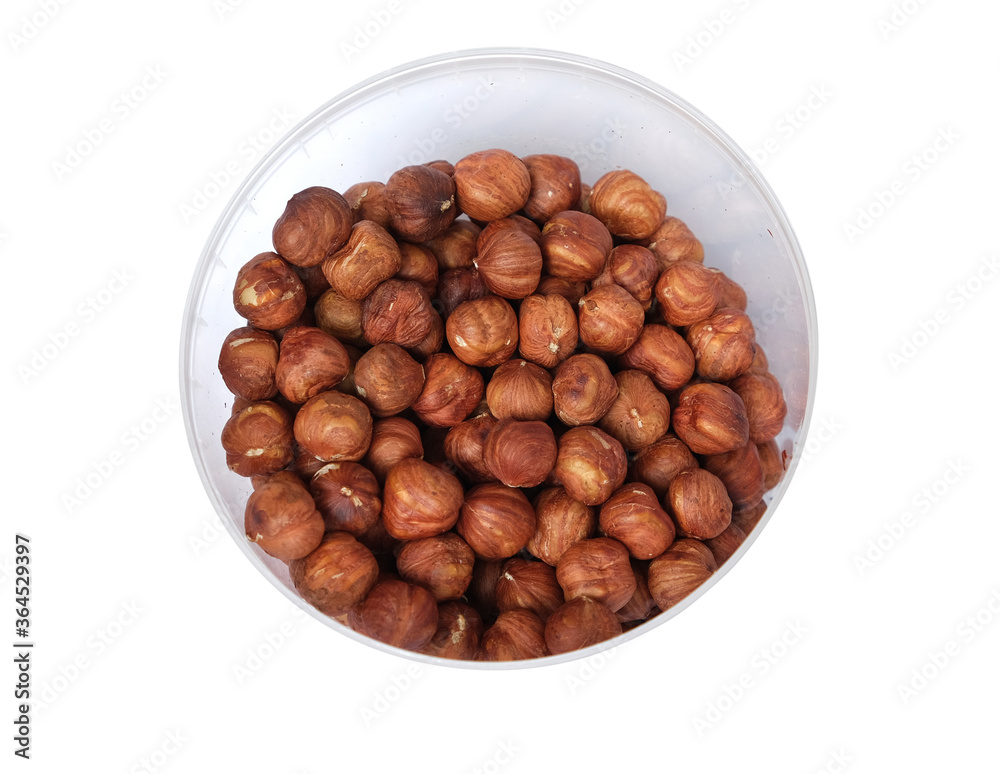 fried hazelnuts in a bucket on a white background fried hazelnuts in a bucket on a white background