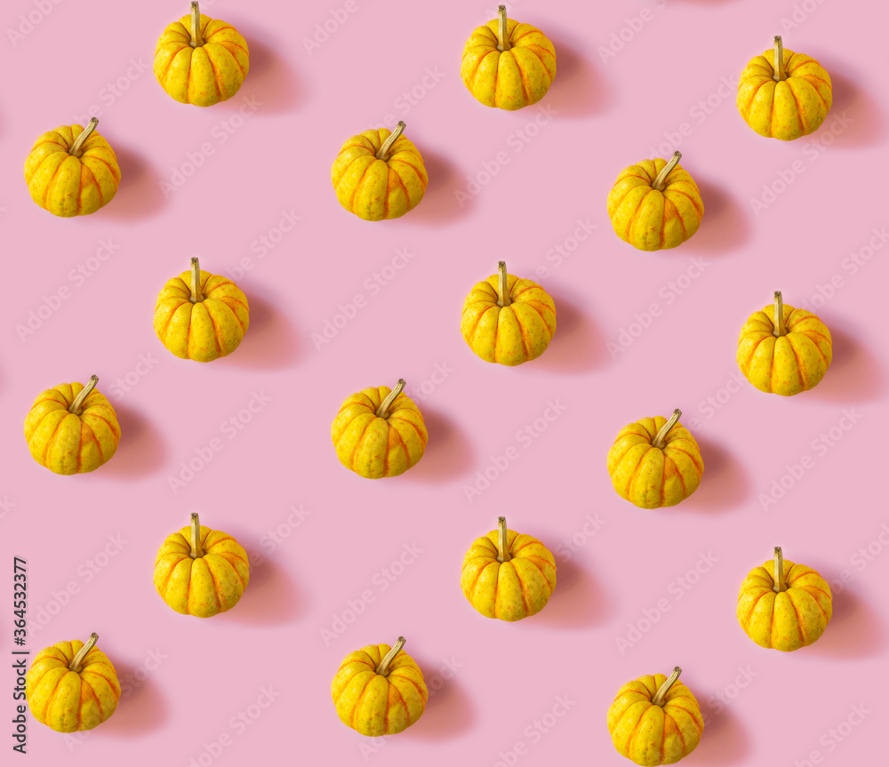 Seamless pattern with pumpkins on a pink background Seamless pattern with pumpkins on a pink background