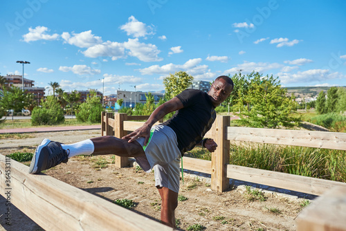 Sportsman stretching a sunny summer day. © franciscojavier