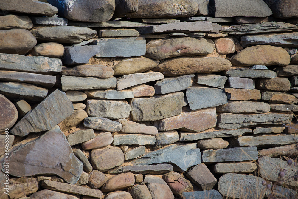 Fototapeta premium Textures of an age old rock wall on a farm in the Tankwa Karoo of South Africa