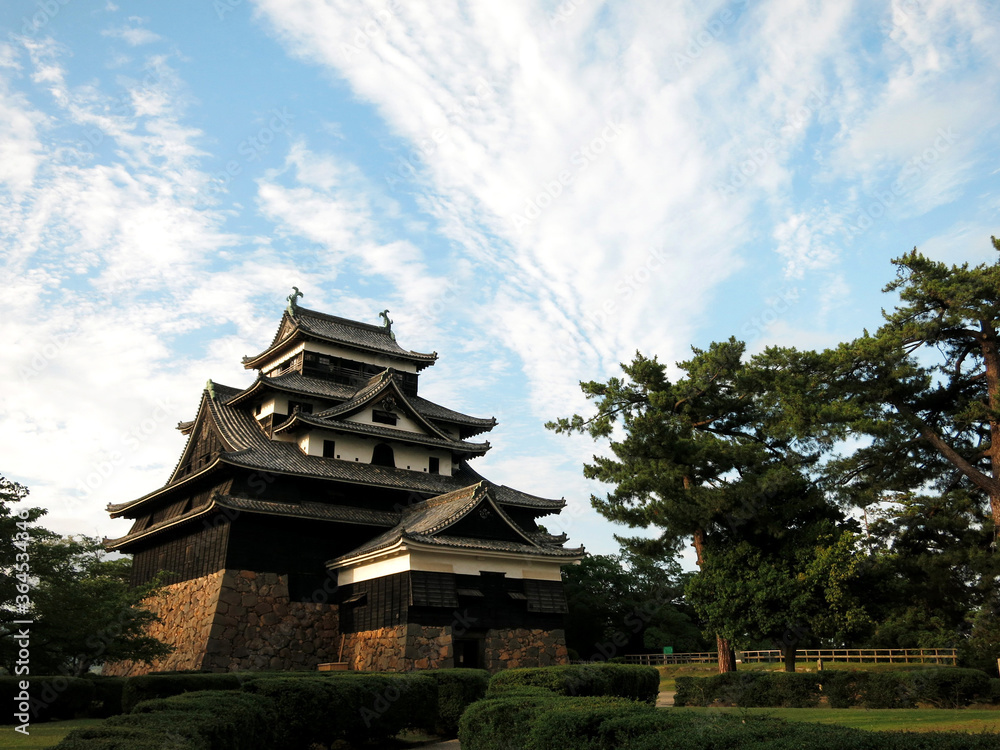 The Keep Tower (Tenshu) of Matsue Castle (松江城天守) under sunset in Matsue City, Shimane Prefecture, JAPAN The Keep Tower (Tenshu) of Matsue Castle (松江城天守) under sunset in Matsue City, Shimane Prefecture, JAPAN