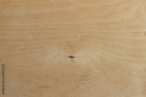 Pine color wooden background. Plywood sheet close up.