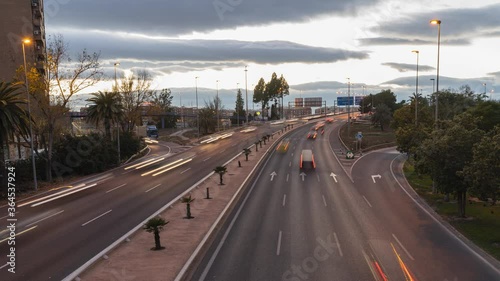 traffic on the highway. Day to night, timelapse. Valencia, Spain.