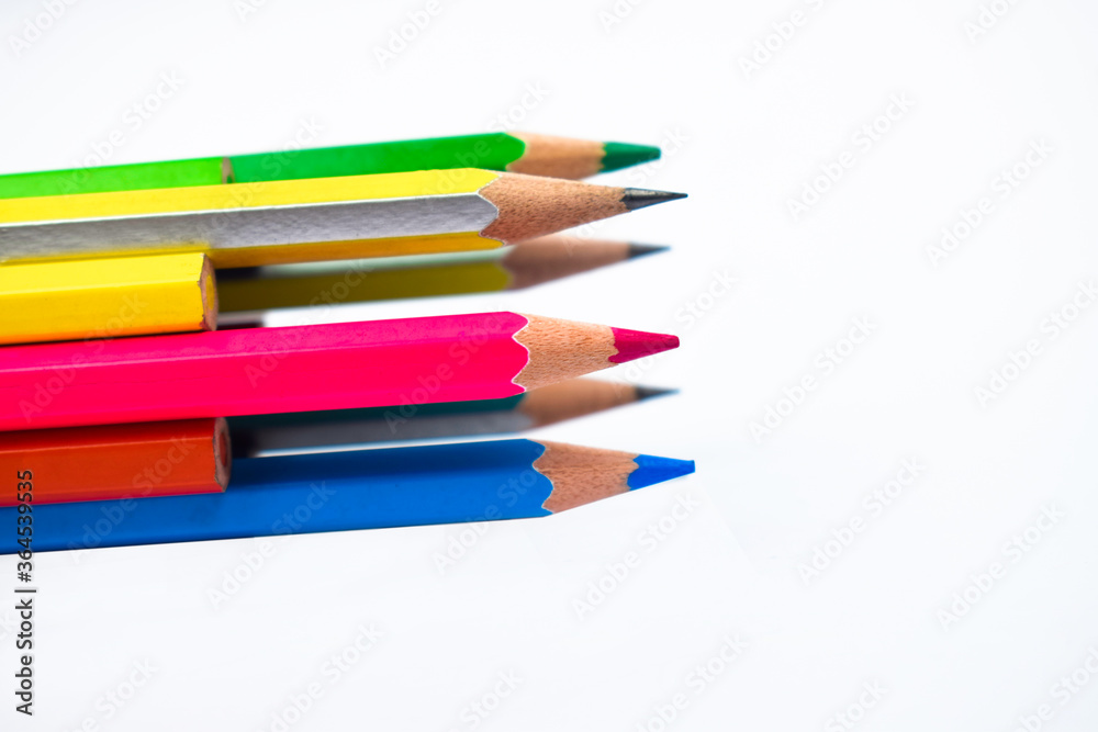Many different colored wood pencil crayons placed together in a circle Many different colored wood pencil crayons placed together in a circle