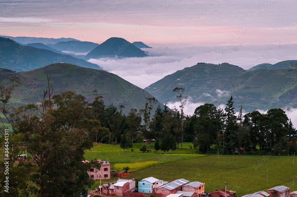 Road of the volcanoes in Ecuador / Volcanic landscape at sunrise on the way from Riobamba to Alausi, Ecuador.