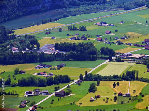 View of the fertile valley with settlemens between the Lakes Alpnachersee and Sarnersee from the Pilatus massif, Alpnach - Canton of Obwalden, Switzerland (Kanton Obwalden, Schweiz) photo