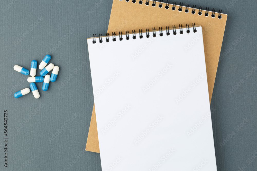 Spiral notebook with pills. Spiral notebook with pills.
