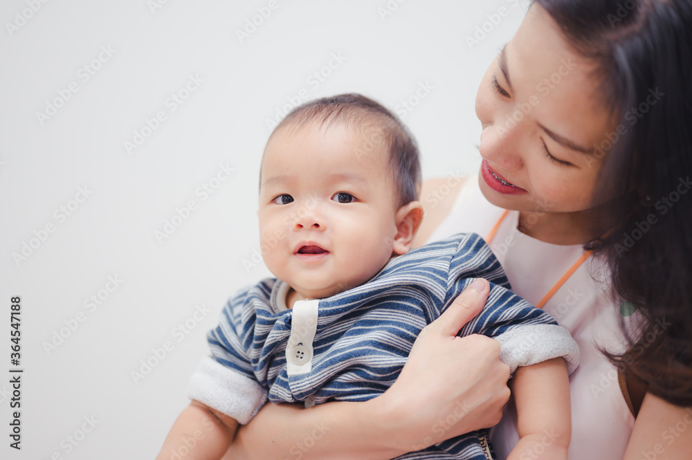 Happy Asian 8 months baby boy with his mother ,Happy family concept Happy Asian 8 months baby boy with his mother ,Happy family concept