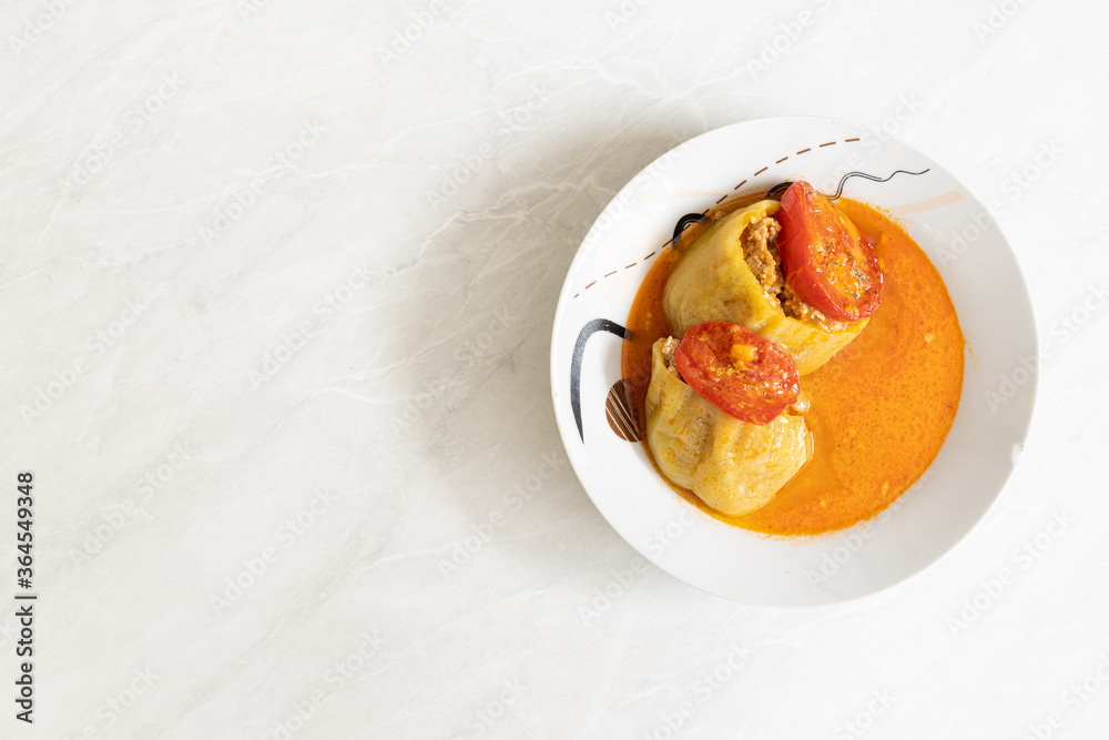Stuffed paprika with minced meat and served on the plate Stuffed paprika with minced meat and served on the plate