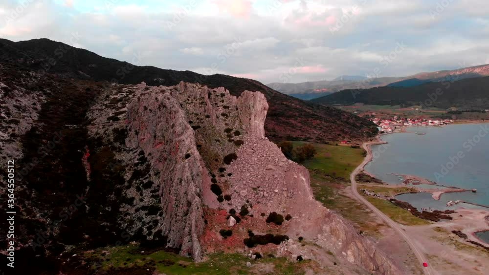 Rocky Coastal Mountains By The Ocean Near The Small Village In Kato Vasiliki, Greece. - aerial drone Rocky Coastal Mountains By The Ocean Near The Small Village In Kato Vasiliki, Greece. - aerial drone