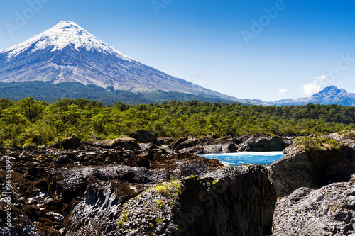 Saltos del Petrohue waterfalls and volcano Osorno in National Park Vicente Perez Rosales, Chile photo