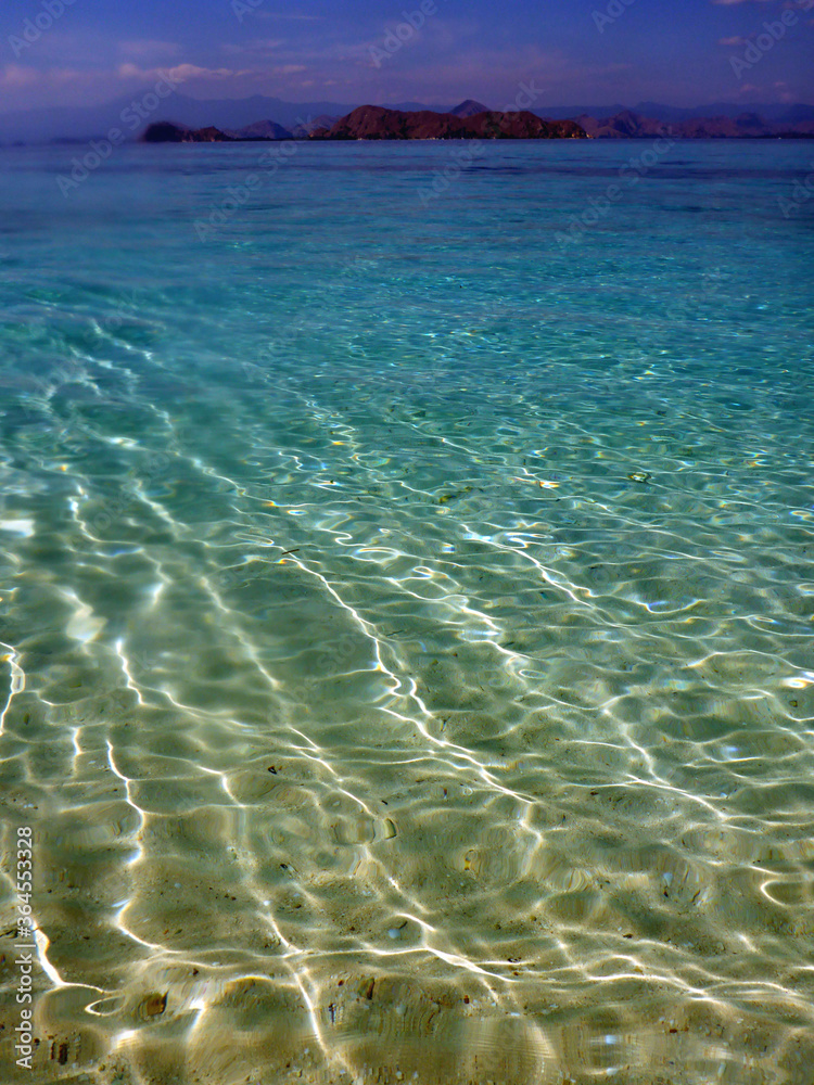 Transparent shallow waters off Kanawa Island near Komodo