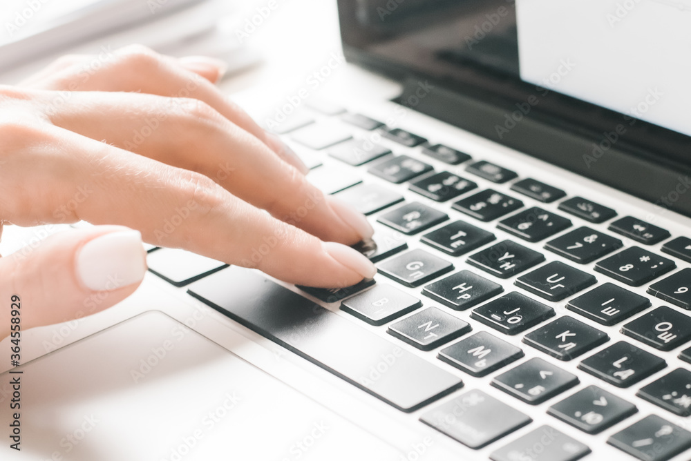 Close-Up Of Female Hands Typing Text On The Keyboard Of Laptop Or Computer. Close-Up Of Female Hands Typing Text On The Keyboard Of Laptop Or Computer.