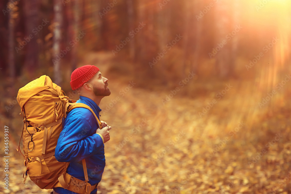 autumn hike with a backpack, sun rays, autumn landscape, a man in the forest glare of light sunset autumn hike with a backpack, sun rays, autumn landscape, a man in the forest glare of light sunset