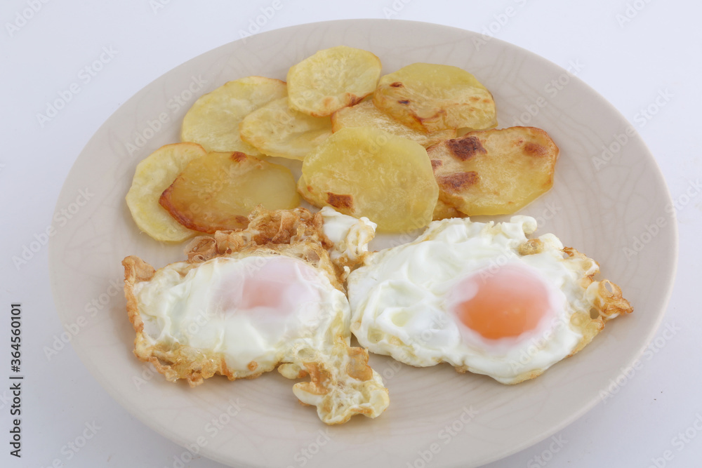 fried eggs with potatoes
