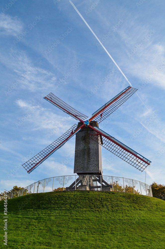 Windmills exposed in the city of Bruges in northern Belgium. These mills do not work and their function is to decorate a public park around the city. The city of Bruges is known as Venice of the North