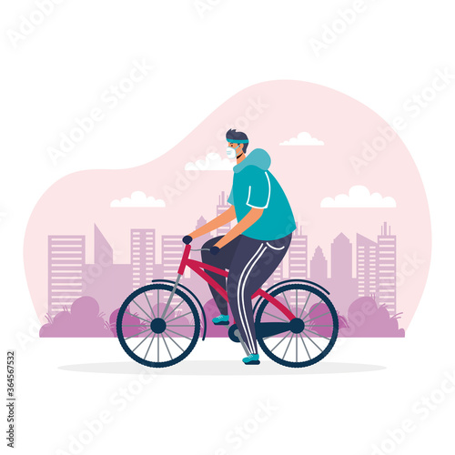 young man riding bicycle sport wearing medical mask