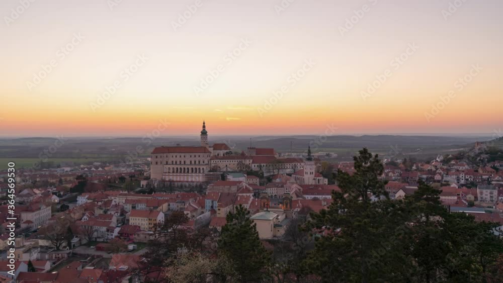 time lapse of a sunset above South Moravian village Mikulov, Czechia, tilt down time lapse of a sunset above South Moravian village Mikulov, Czechia, tilt down