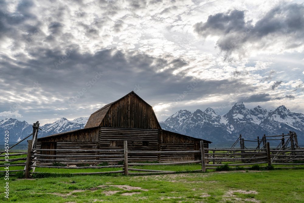 Mormon Row in Jackson Hole, Wyoming on a partially cloudy day Mormon Row in Jackson Hole, Wyoming on a partially cloudy day