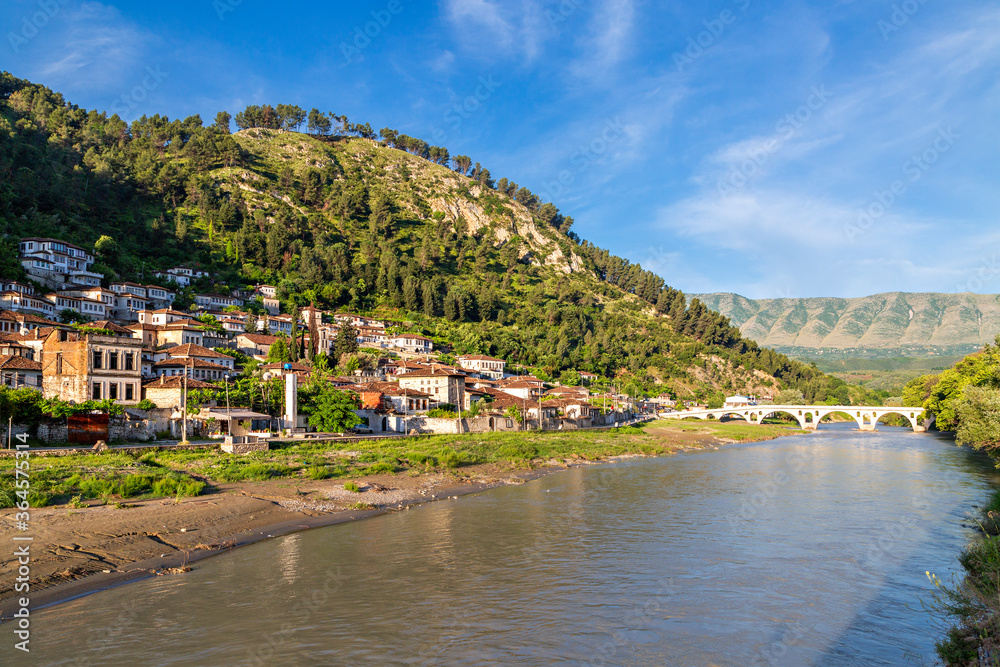 Old bridge over the Osumi River and traditional houses in Berat, Albania