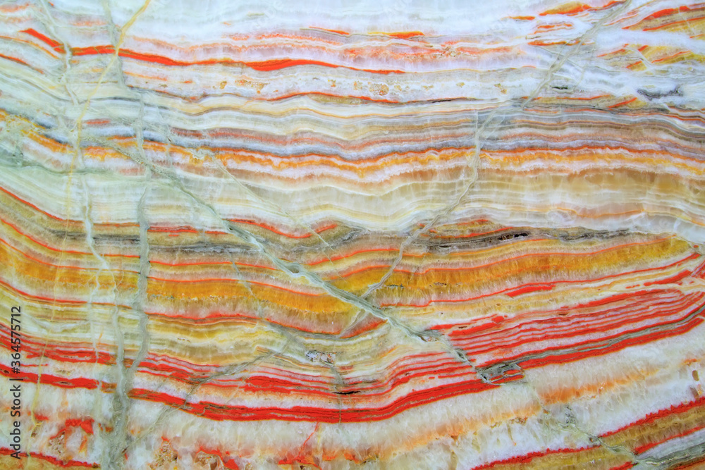Onyx texture background of natural stone with polished orange streaks. marble texture used for indoor and outdoor home decoration