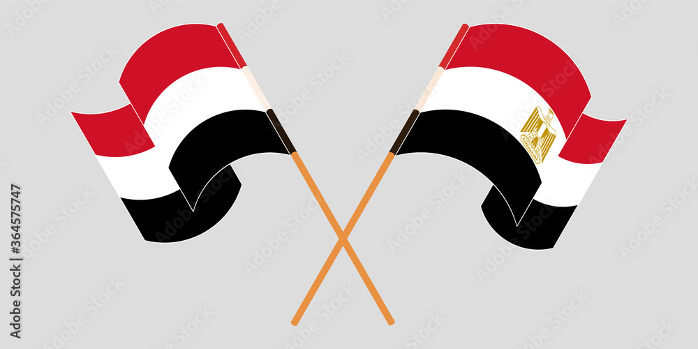 Crossed and waving flags of Egypt and Yemen Crossed and waving flags of Egypt and Yemen
