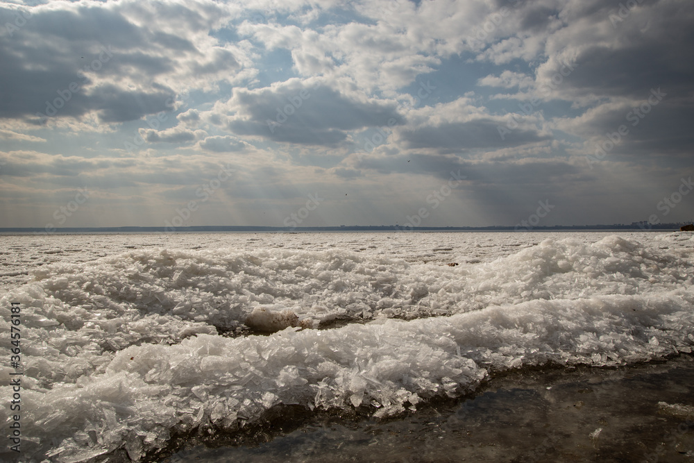 Fototapeta premium clouds and frozen river