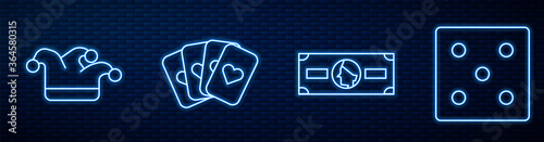 Set line Stacks paper money cash, Joker playing card, Deck of playing cards and Game dice. Glowing neon icon on brick wall. Vector.
