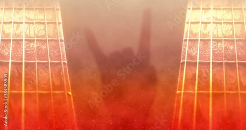 Rock and roll animated background with fire theme, rock hand sign and the guitar neck.