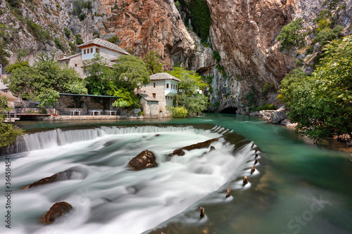 Waterfalls with Dervish house known as Tekke in the background, Blagaj, Bosnia and Herzegovina photo