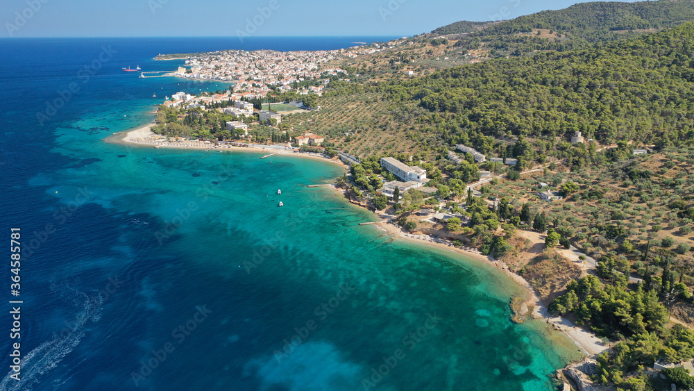 Aerial drone photo of secluded beaches in Ligoneri area near old town of Spetses island, Saronic gulf, Greece