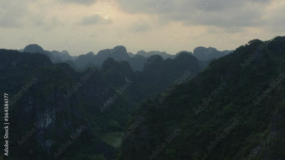 Ninh Binh, Tam Coc Aerial/drone shot of dramatic Green Limestone Mountains, Vietnam Ninh Binh, Tam Coc Aerial/drone shot of dramatic Green Limestone Mountains, Vietnam
