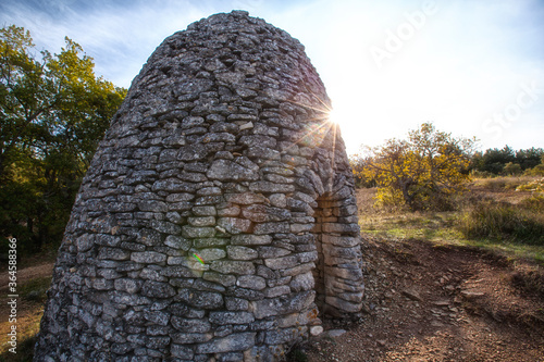 An old borie, a stone hut, in Provence, France photo