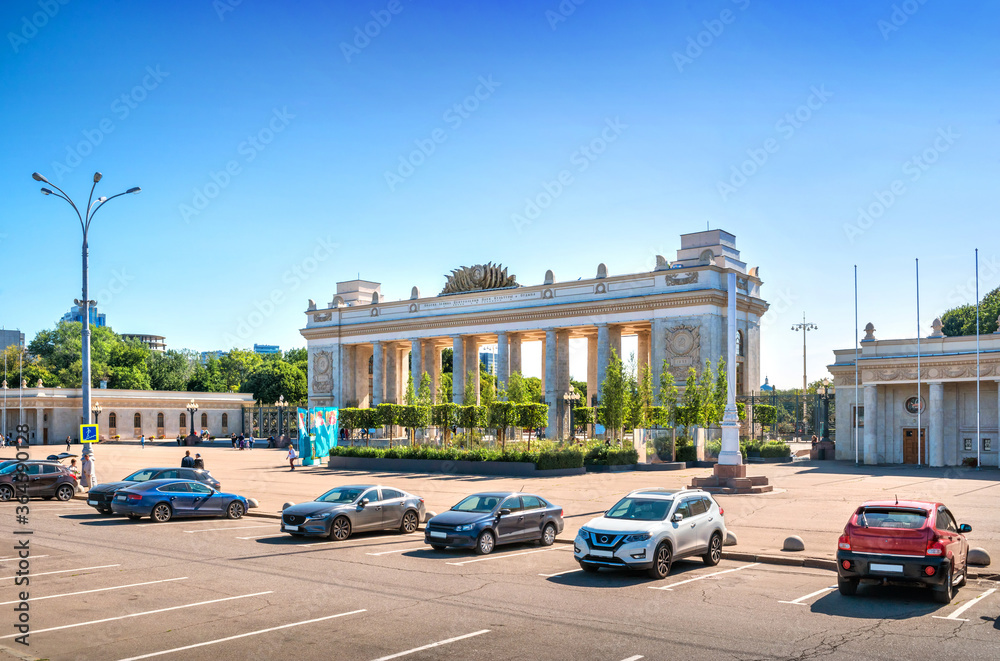 The building of the entrance to Gorky Park in Moscow and cars in the parking