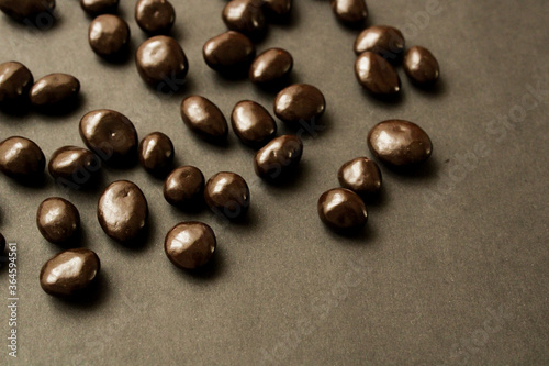 Dark chocolate drops on a dark background