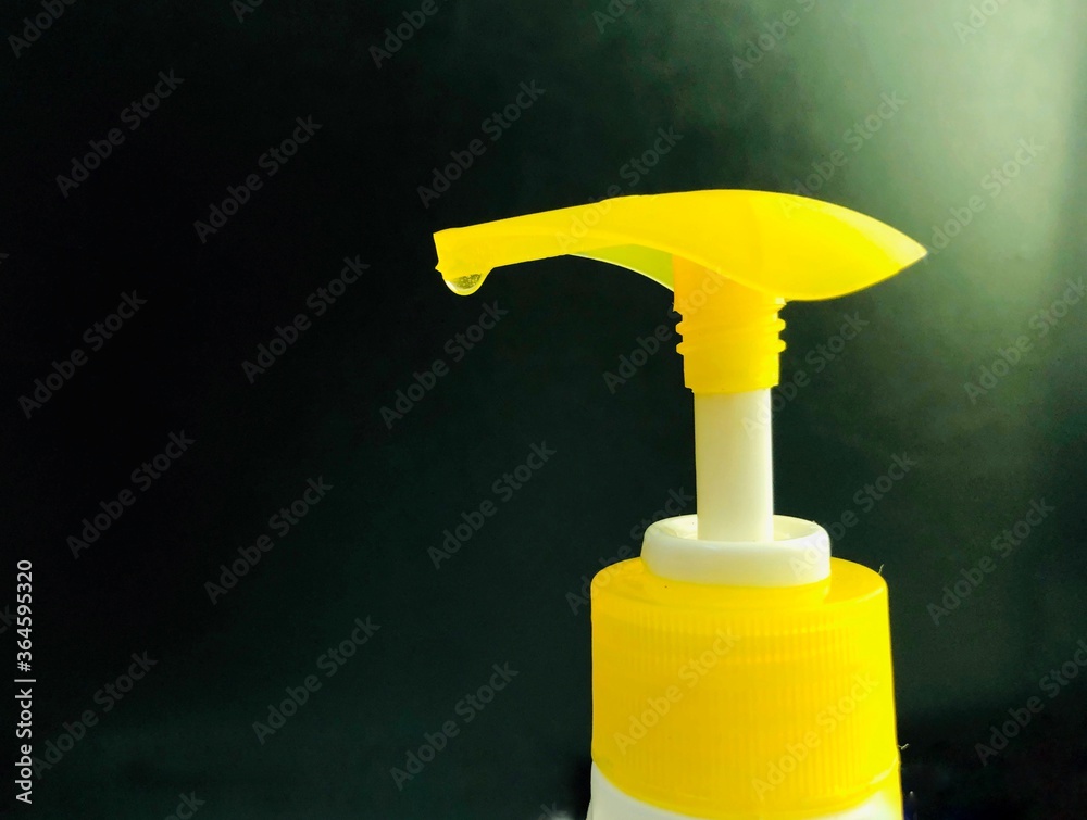 yellow bottle with hand wash liquid drop yellow bottle with hand wash liquid drop