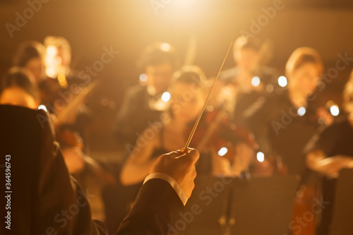 Canvas Print Conductor leading orchestra