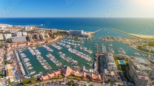 Fototapeta Naklejka Na Ścianę i Meble -  Aerial photo of the bay, Vilamoura, Quarteira, Portugal. Marina with luxury yachts.