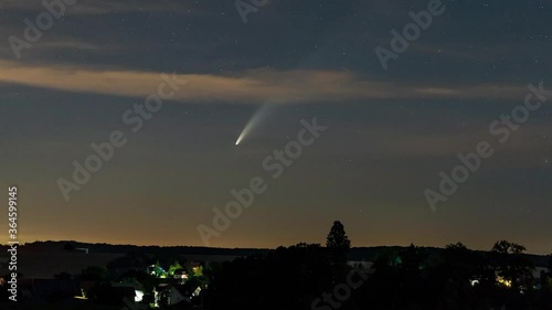 Babstadt, Germany - July 12, 2020: Comet C/2020 F3 (Neowise) moving low over the horizon, about 1 hour after sunset.
