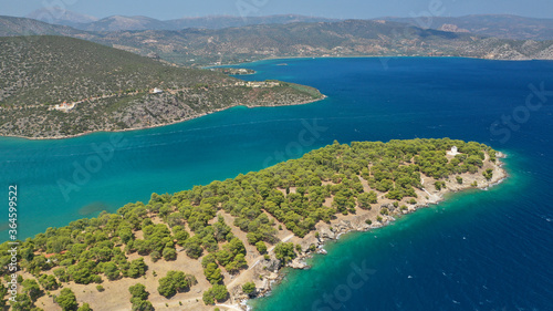 Aerial drone photo of picturesque city of Ermioni built in peninsula with forest of Bistis at the end, Argolida, Peloponnese, Greece